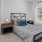 a bedroom with a bed and a desk