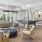 a clubroom with a couch, a pool table and chairs