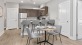 a kitchen with a dining table and chairs