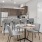 a kitchen with a dining table and chairs
