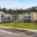 an apartment complex with a parking lot
